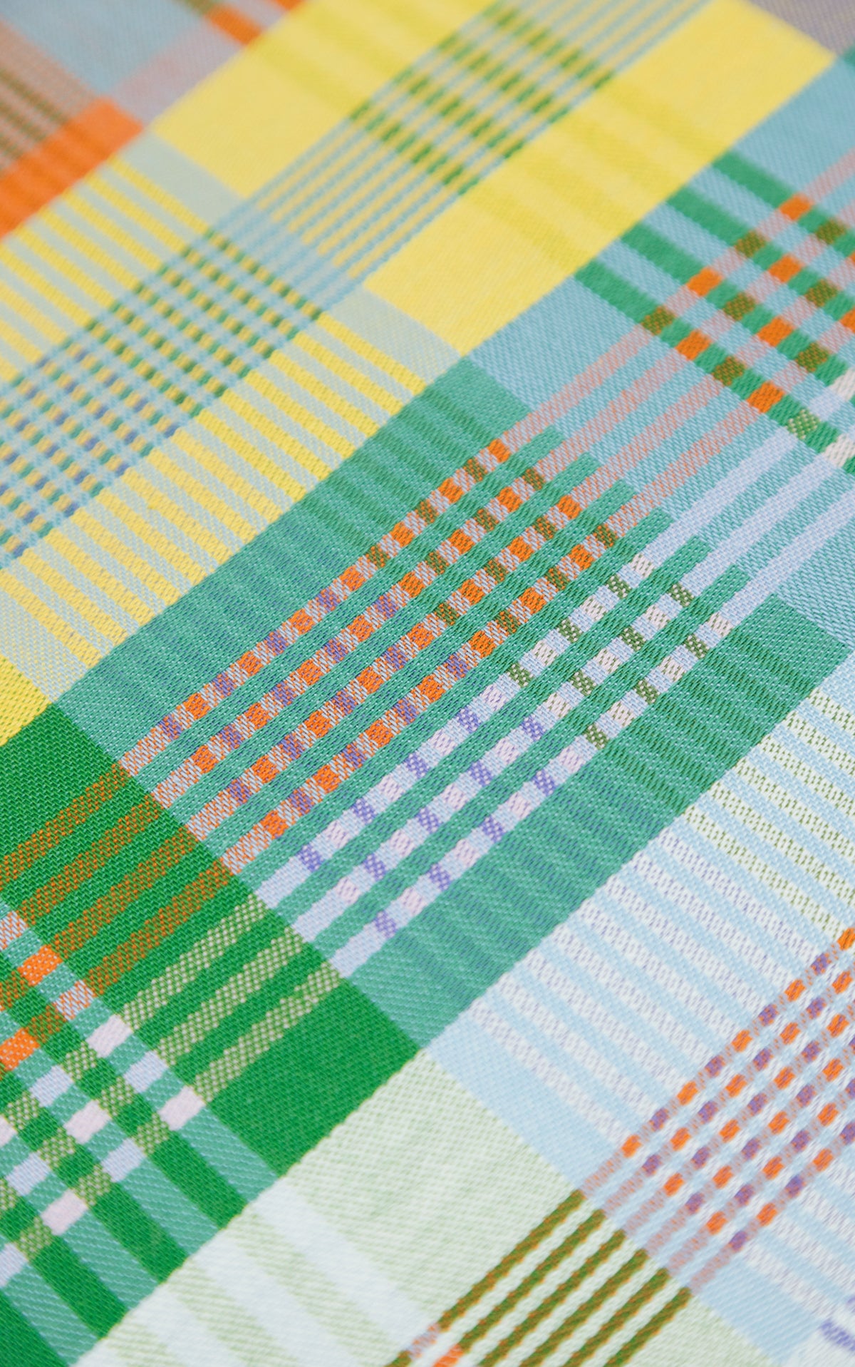Viskestykke med mønster i grøn, gul og blå-lilla  · Lavet af garnrester fra tekstilindustrien · Designer af Foekje Fleur hos Niedziella & Friends